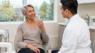 Older adult discussing dry mouth and oral health with a general dentist in Ottawa